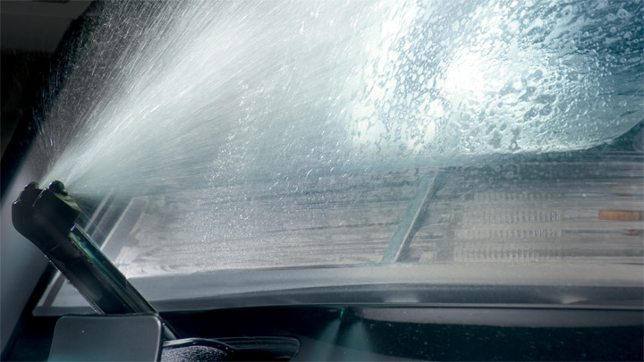 Headlamp washing system