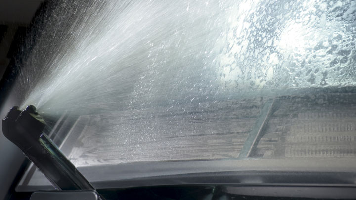 Headlamp washing system