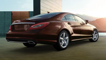 in Cuprite Brown metallic with 18-inch AMG wheels.
