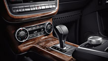 in Black Premium leather with Burl Walnut wood trim