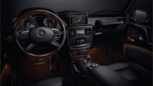in Black Premium leather with Burl Walnut wood trim
