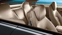 Front sport seats with integrated head restraints