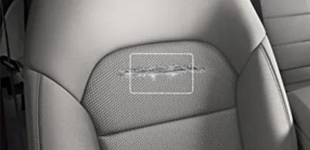 A close-up of a tear in the upholstery of a seat
