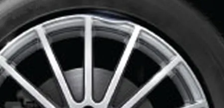 A close-up of a dented rim.