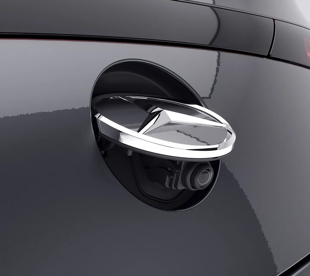  The standard rearview camera is concealed behind the Star ornament, to help keep it clean until it's needed. Available Surround View cameras can team up for a virtual birdseye view.