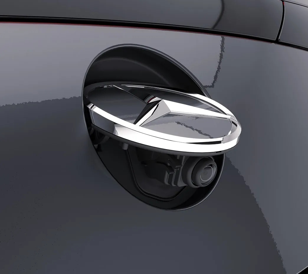 The standard rearview camera is concealed behind the Star ornament, to help keep it clean until it's needed. Available Surround View cameras can team up for a virtual birdseye view.