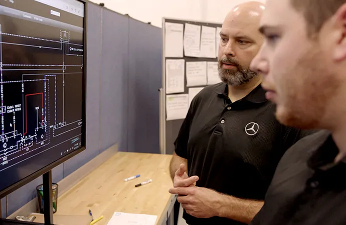 Central Diagnostic Technicians review chart on a computer monitor
