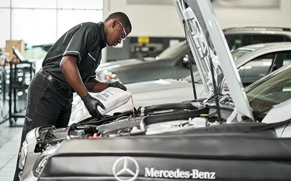 Mercedes-Benz oil change being done by Mercedes-Benz technician