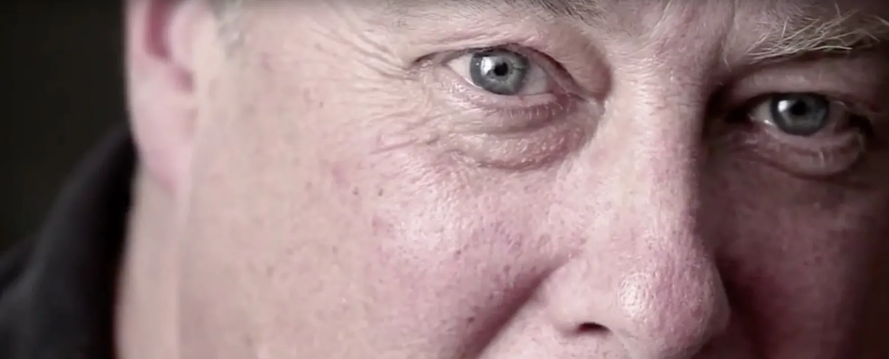 A close-up of a man's eyes as he tells an emotional story.